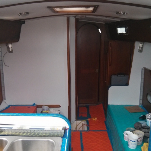 looking forward from companionway after painting bulkheads, re-installing chainplates, and installing new angle braces.