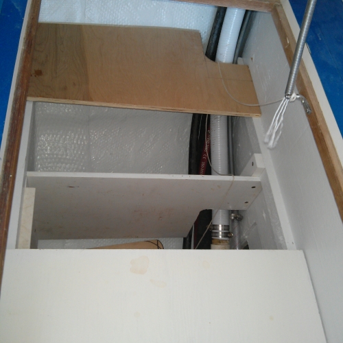 Unpainted board represents space gained by removing vertical panel in locker