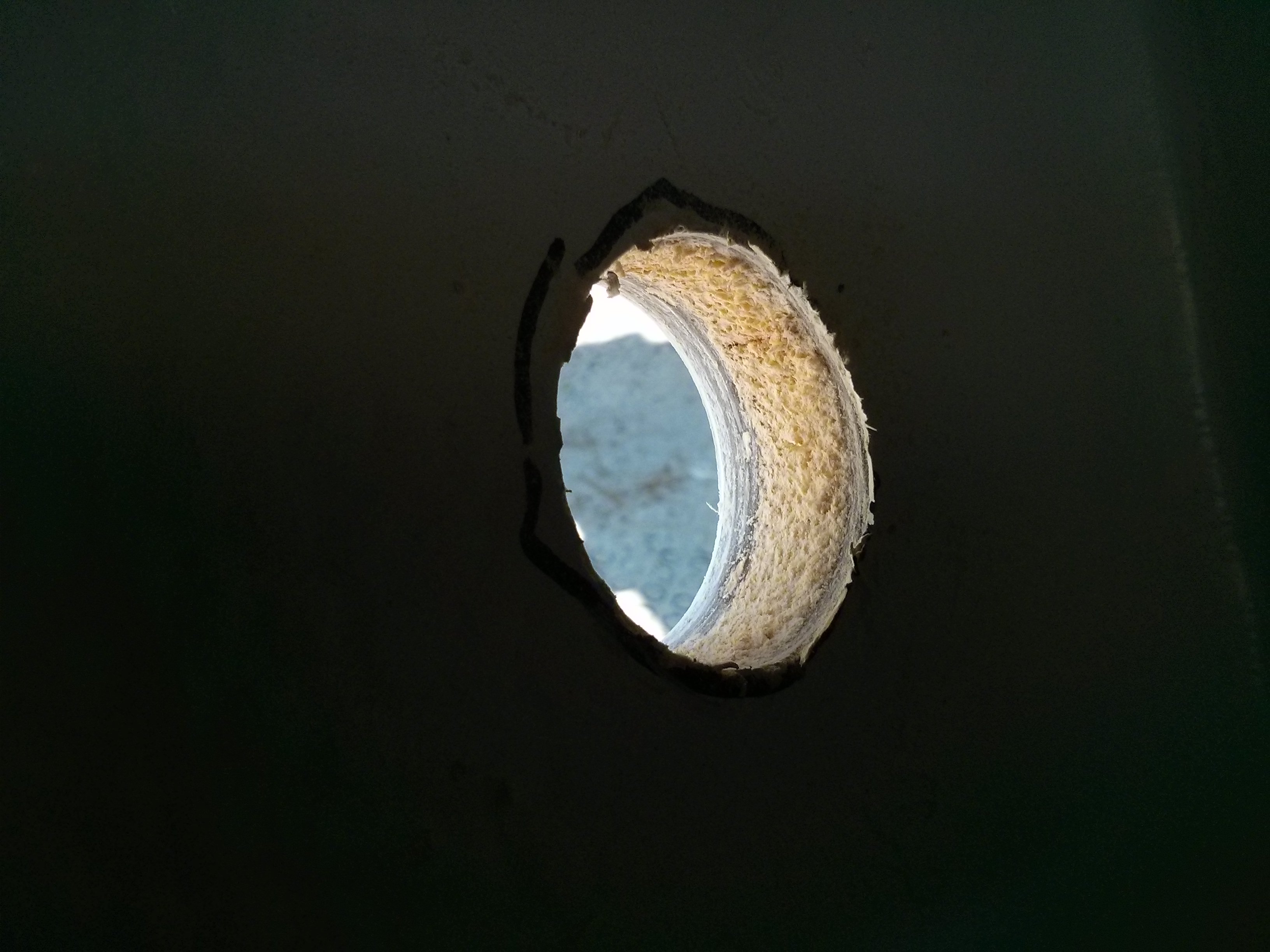 Close up view of 1-7/8" hole in port hull.