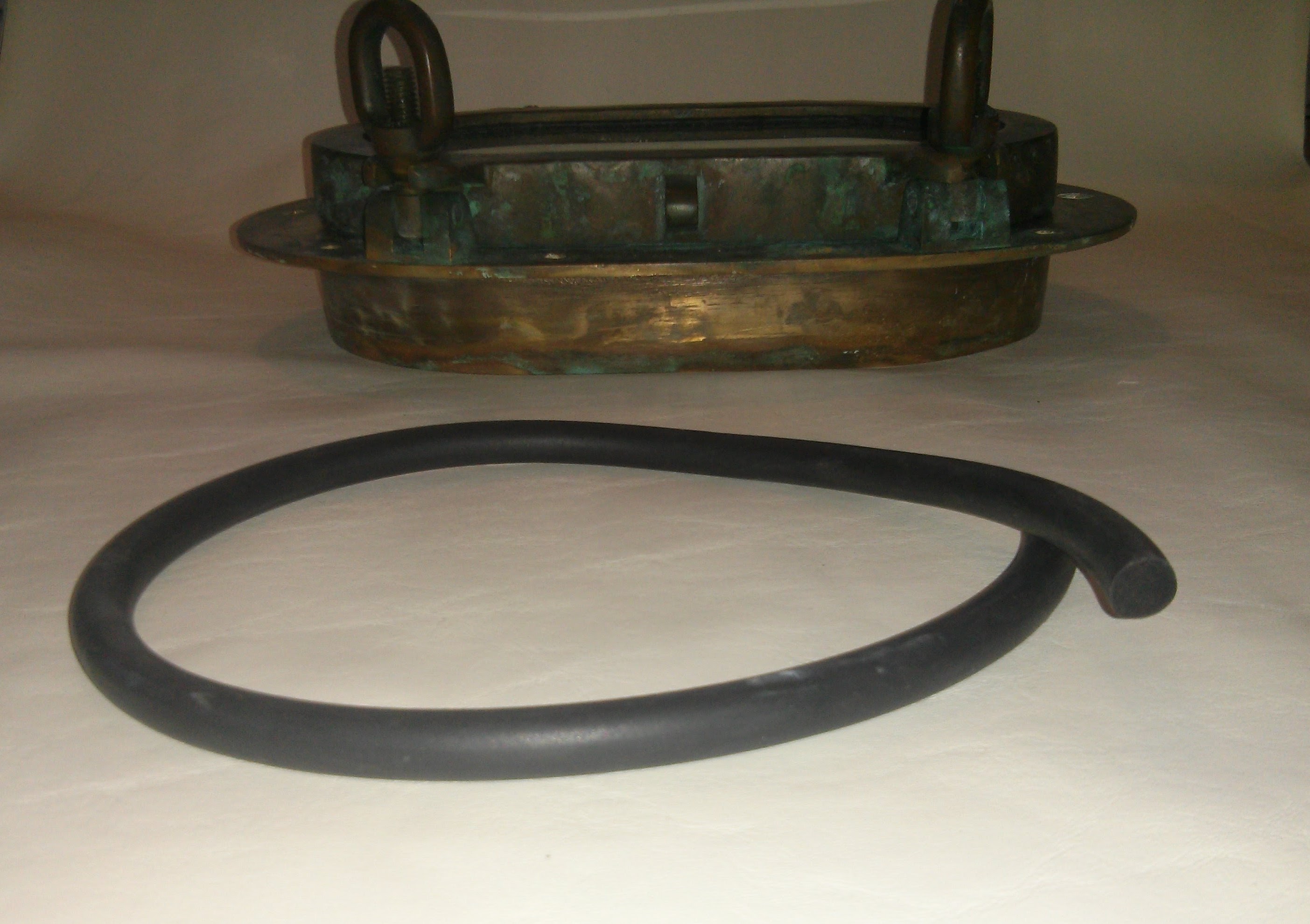 SOLD - New 1/2" round gasket material with port in background