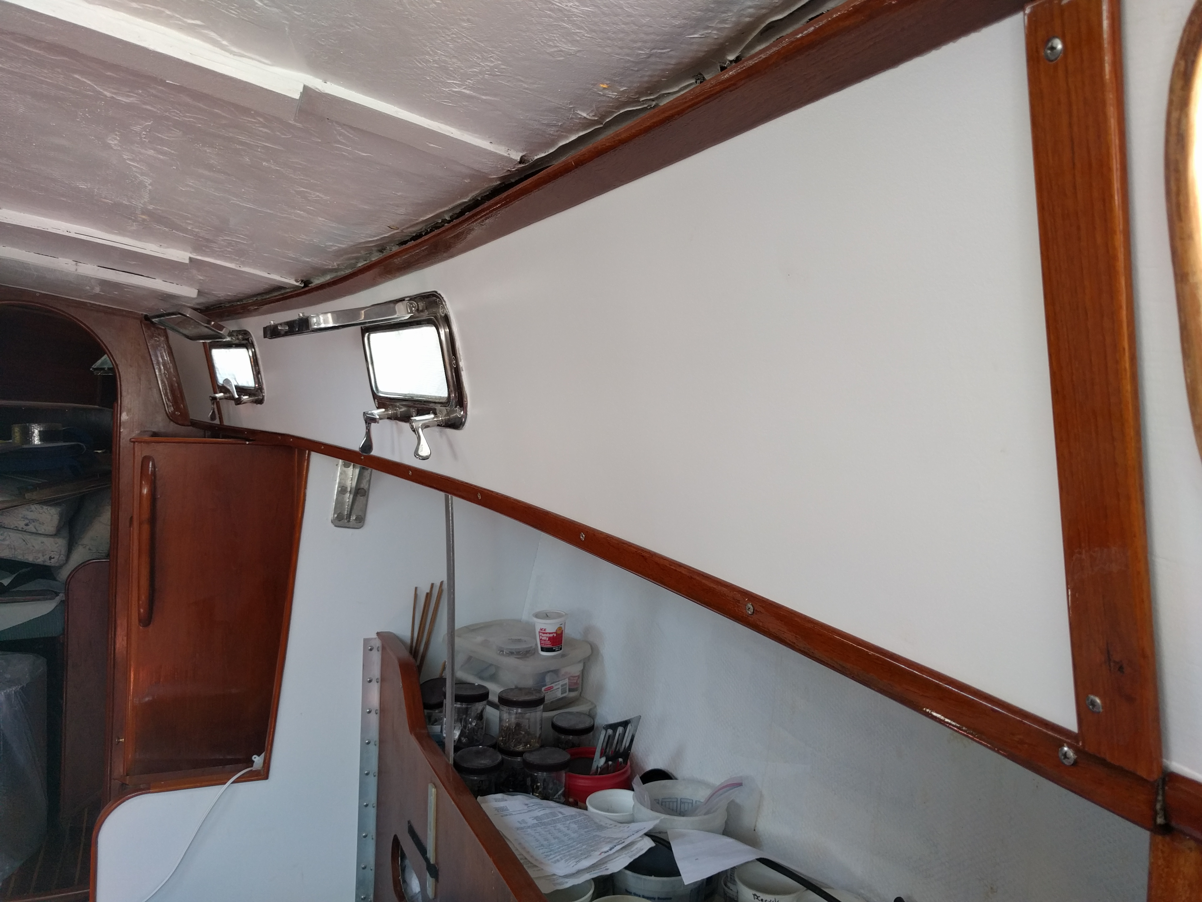 White paint and refinished trim in starboard salon